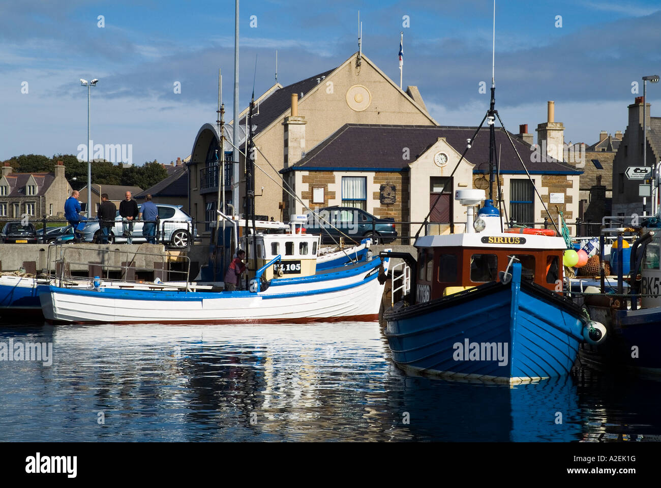 dh Scotland coastal harbor KIRKWALL HARBOUR ORKNEY Scottish Fishing boats alongside quayside boat moored Stock Photo