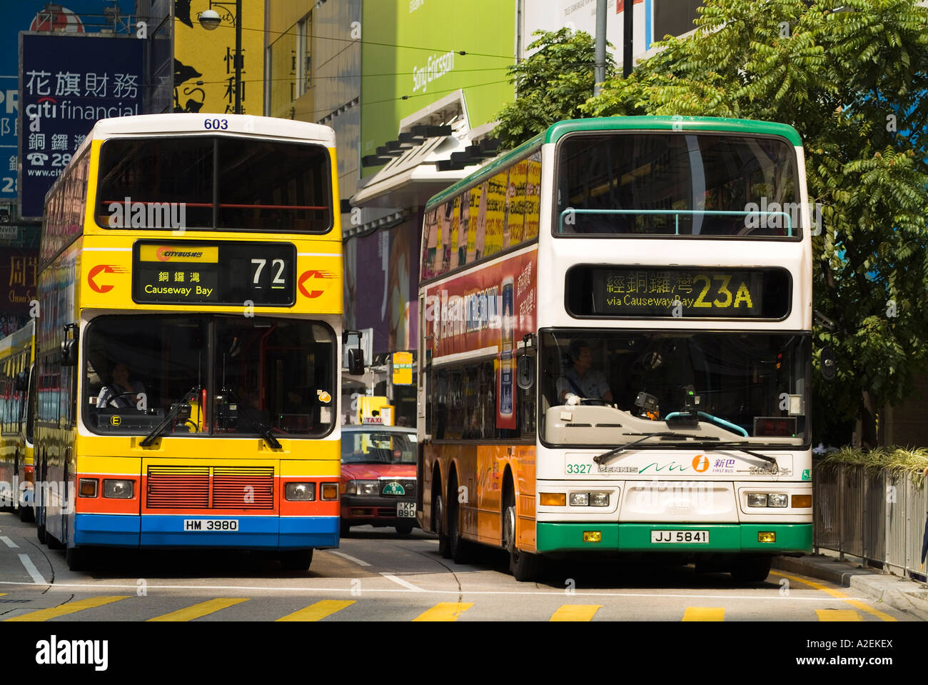 dh Yee Wo street CAUSEWAY BAY HONG KONG Two rival bus companies First Bus and Citybus double decker buses transport Stock Photo