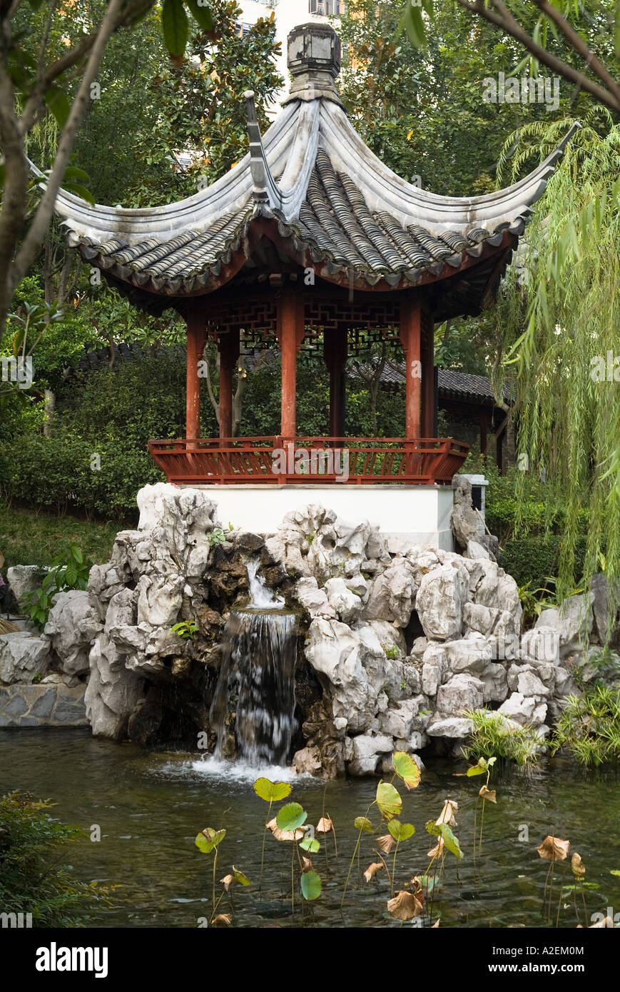 dh Kowloon Walled City Park KOWLOON PARK HONG KONG Chinese Pagoda with waterfall and pond pavilion parkland Stock Photo