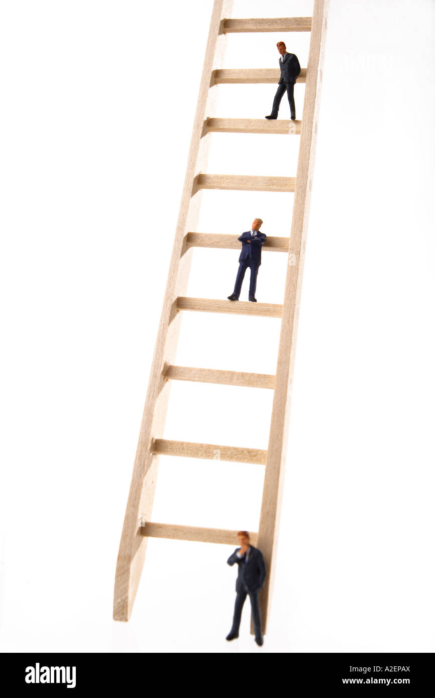 Three business men figurines on ladder Stock Photo