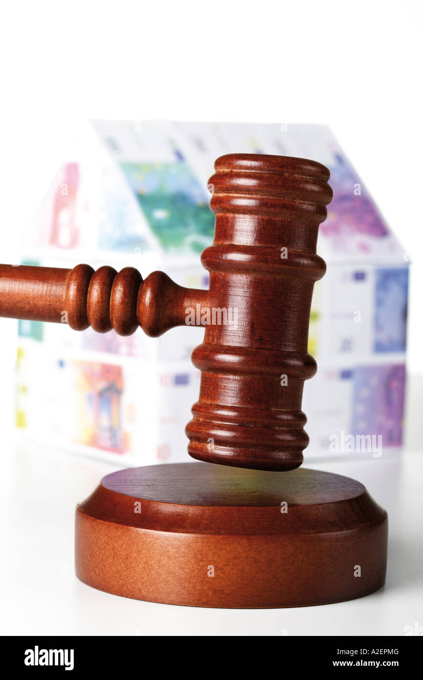 Auctioneer´s hammer and house of Euro notes Stock Photo