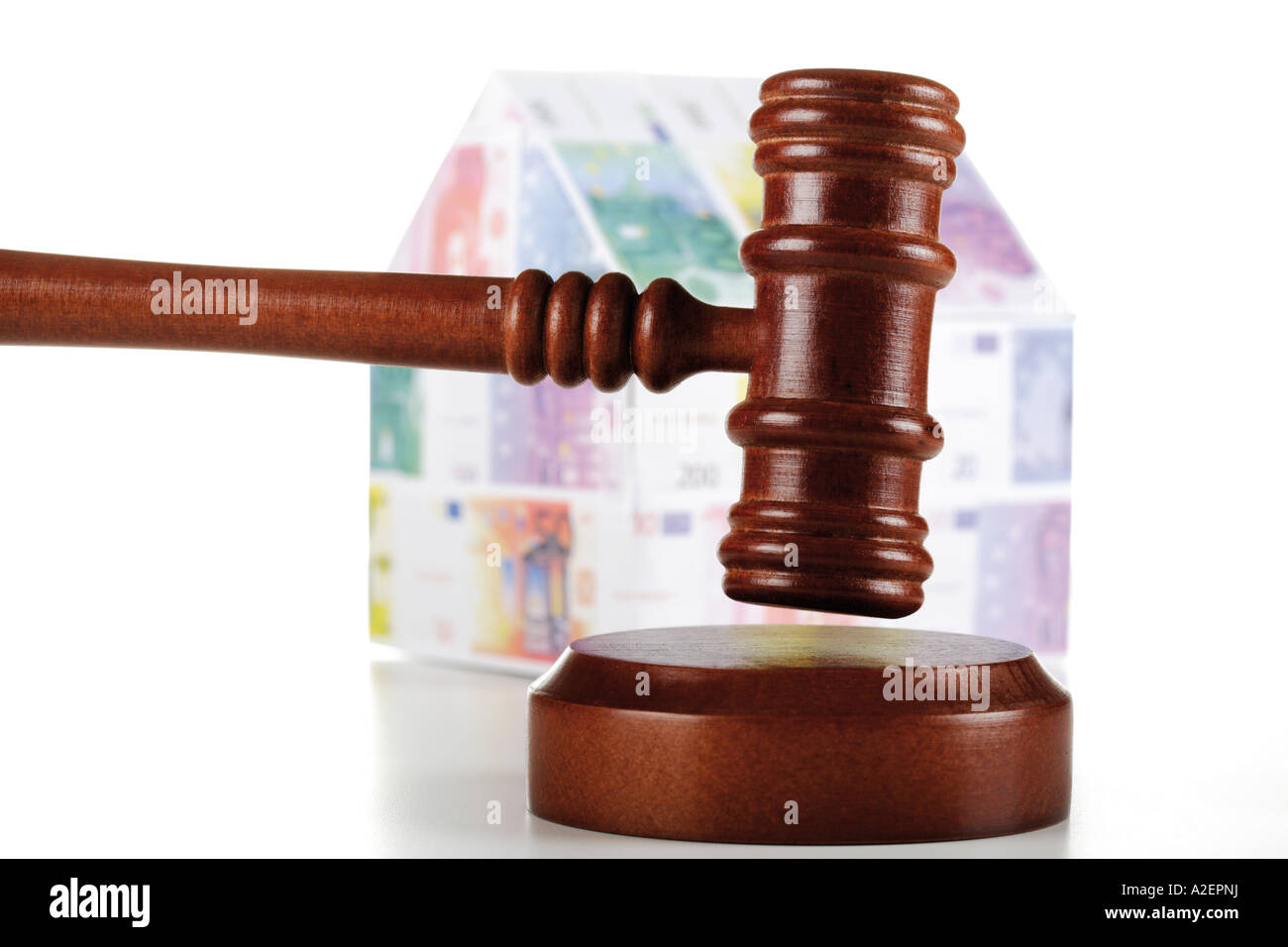 Auctioneer's hammer and house of Euro notes, close-up Stock Photo