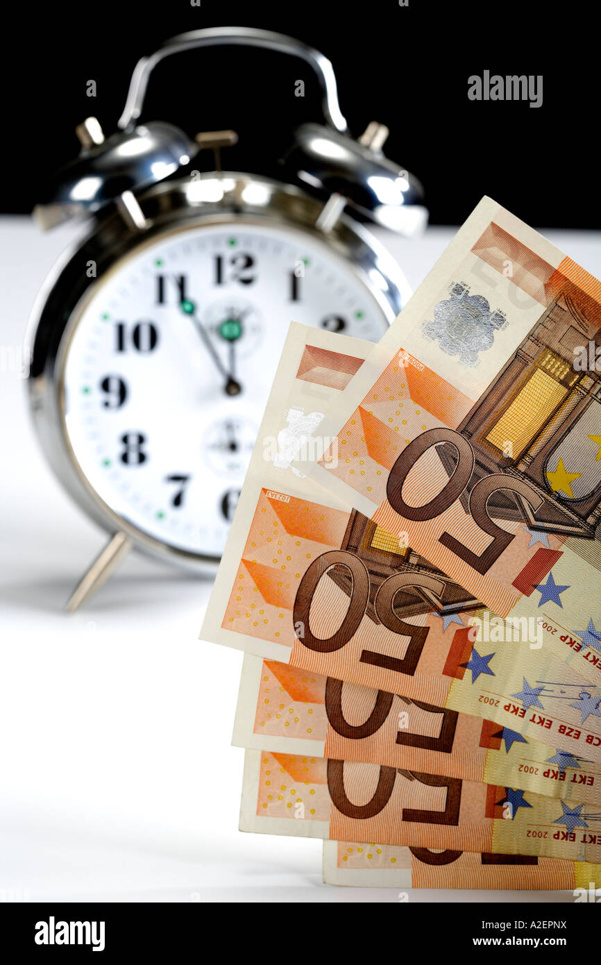 Alarm clock and Euro notes Stock Photo