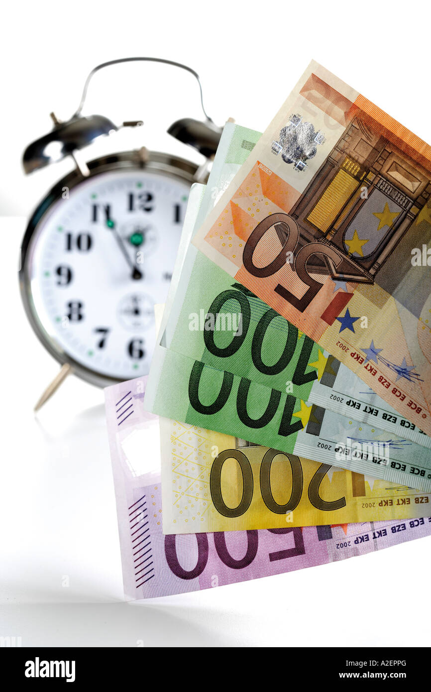 Alarm clock and Euro notes Stock Photo