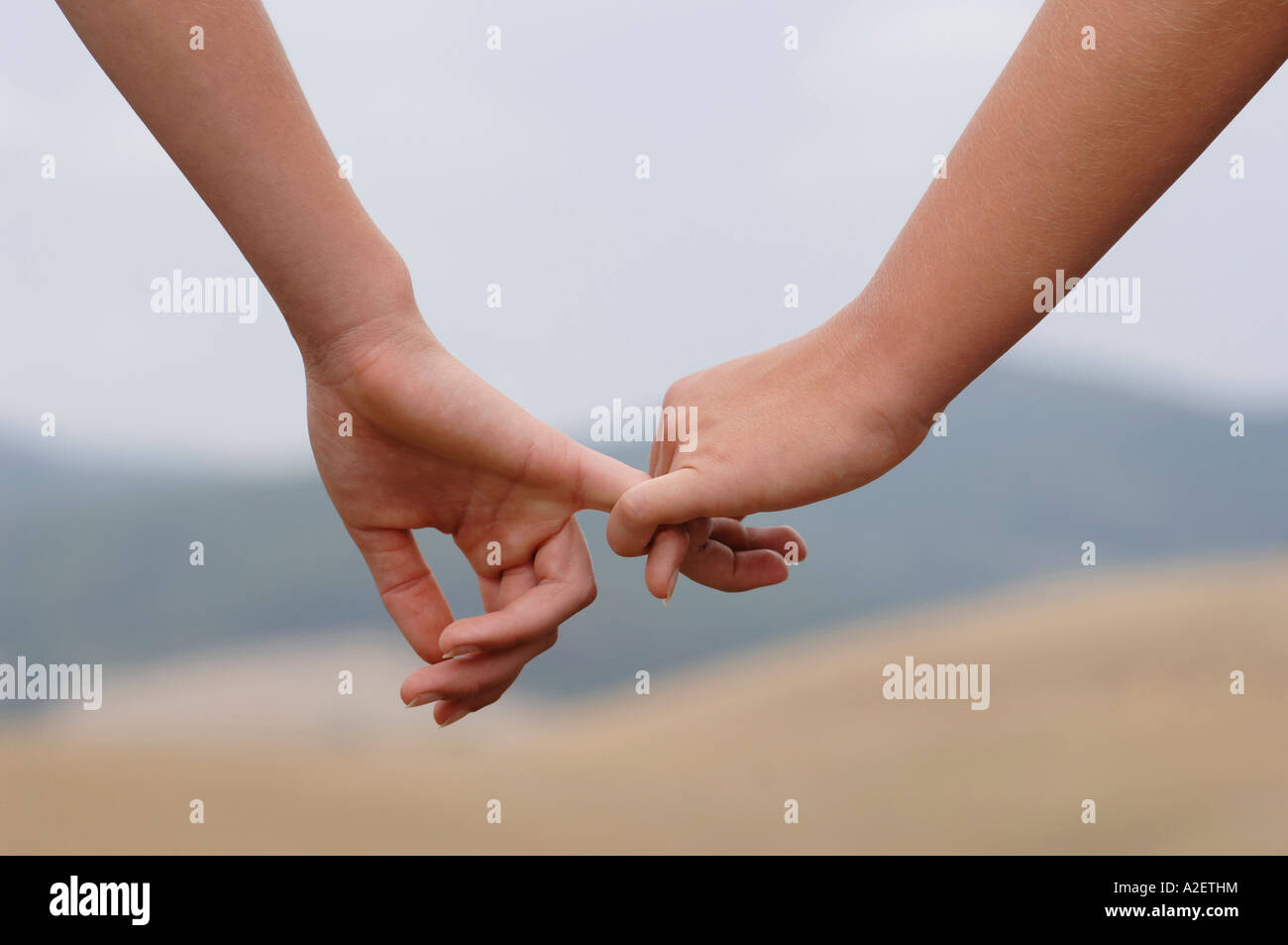 Holding hands, close-up Stock Photo - Alamy
