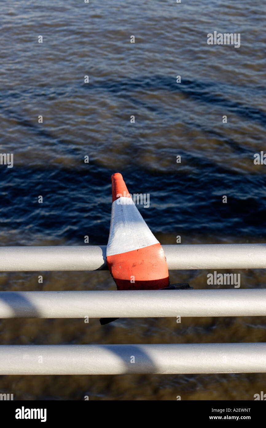 Squashed bent traffic cone stuck on side of bridge Stock Photo Alamy
