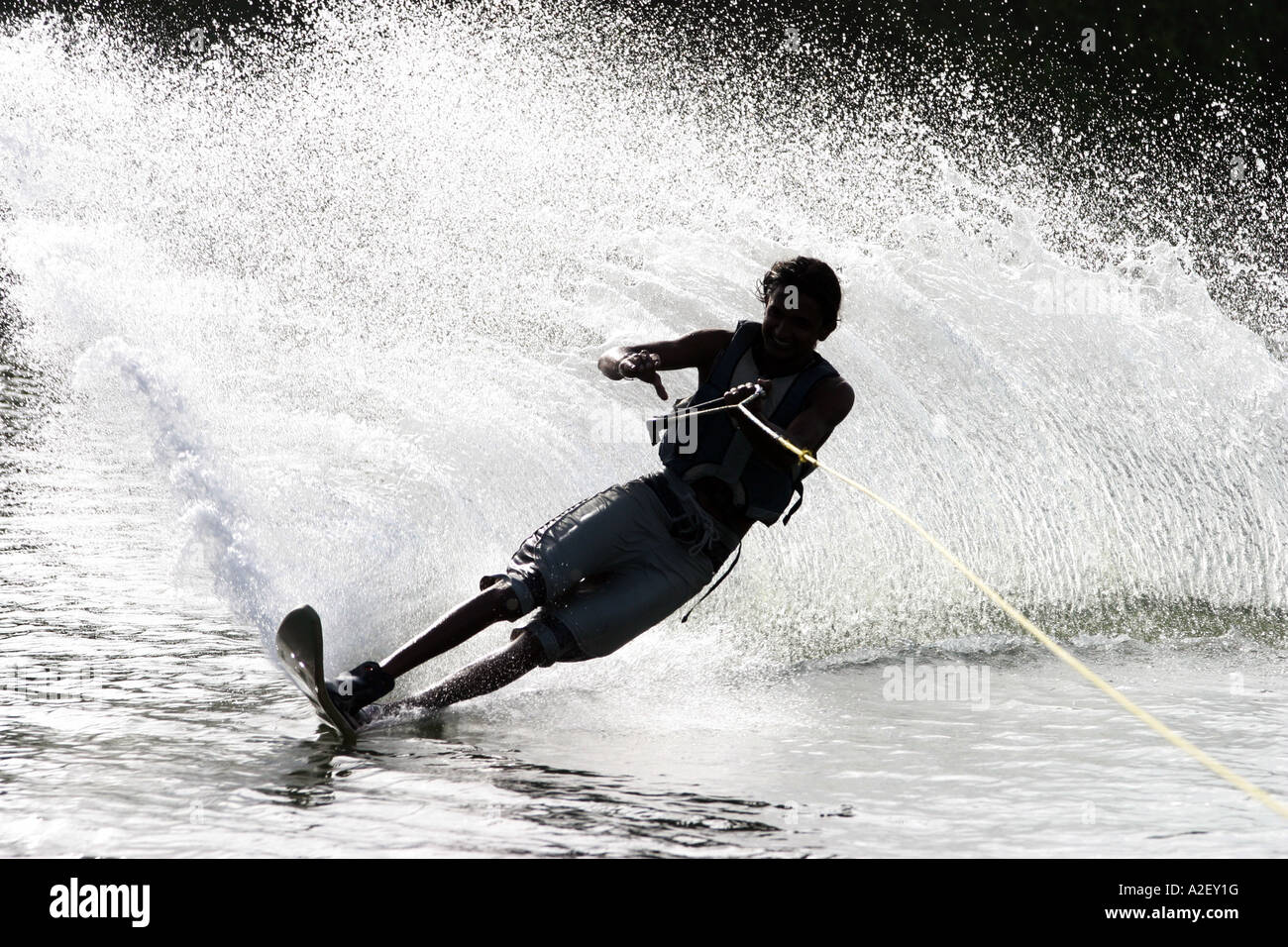 A skilled local teenager water skiing, Bentota, Sri Lanka Stock Photo