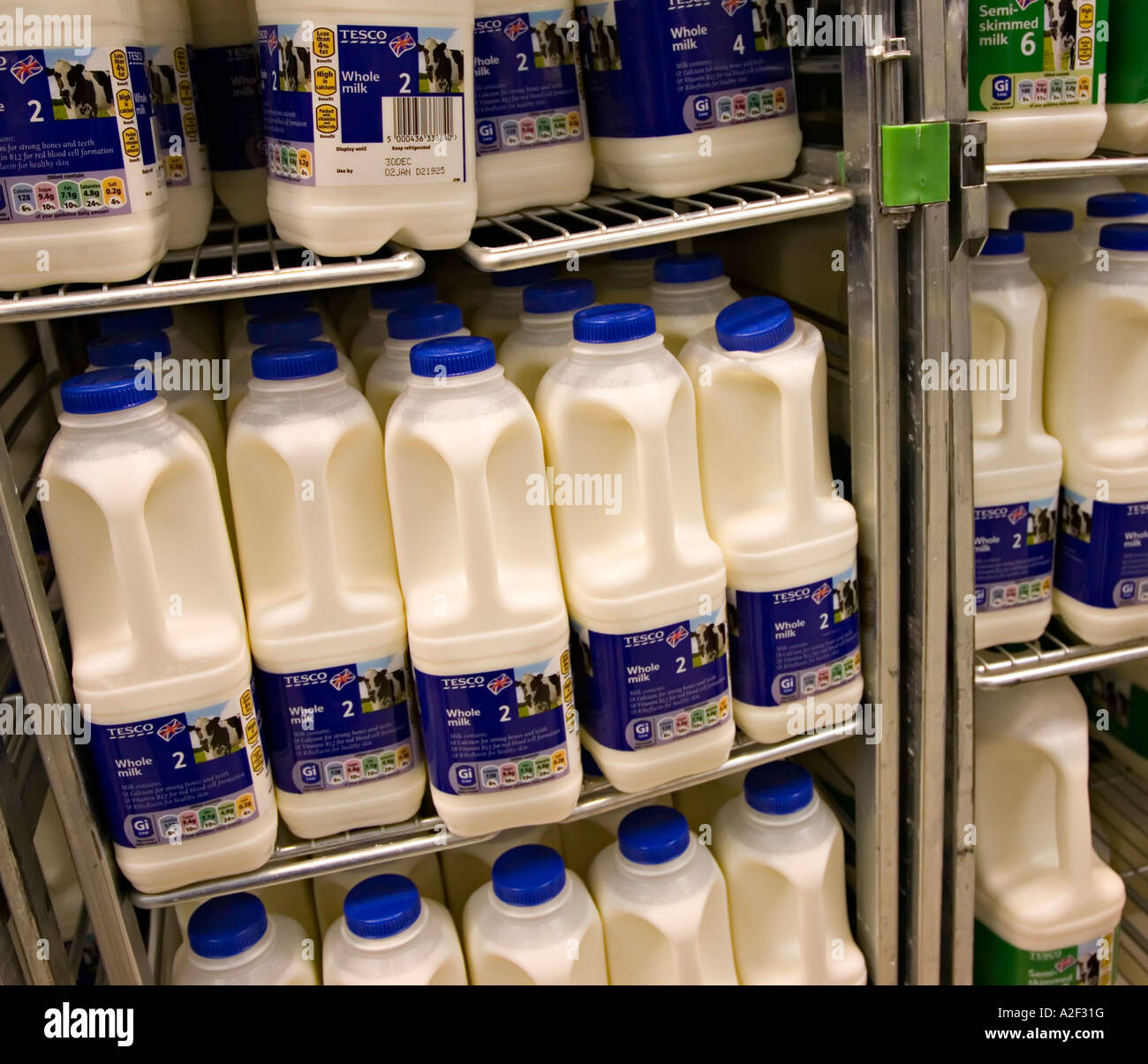 Whole milk on sale in supermarket UK Stock Photo Alamy