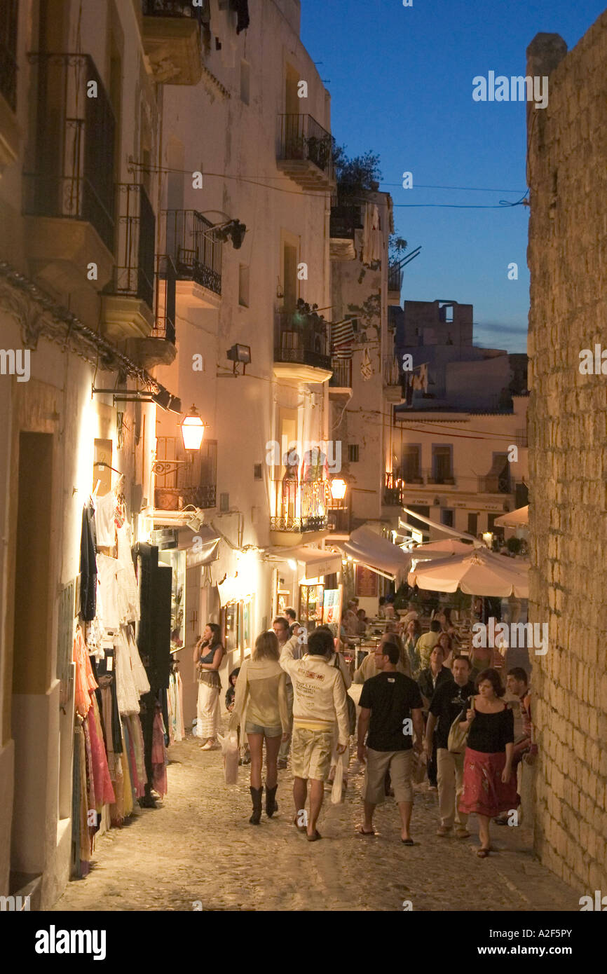 Spain Baleares island Ibiza town at twilight fashion shops and souvenirs in Dalt vila people Stock Photo