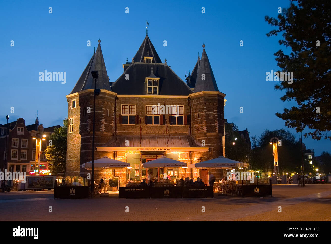 Amsterdam De Waag former weighbridge now Cafe and Restaurant twilight Stock Photo