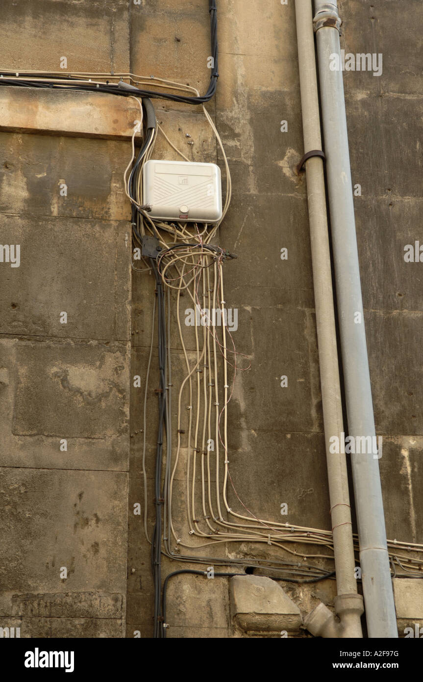 electric cables at house facade Stock Photo