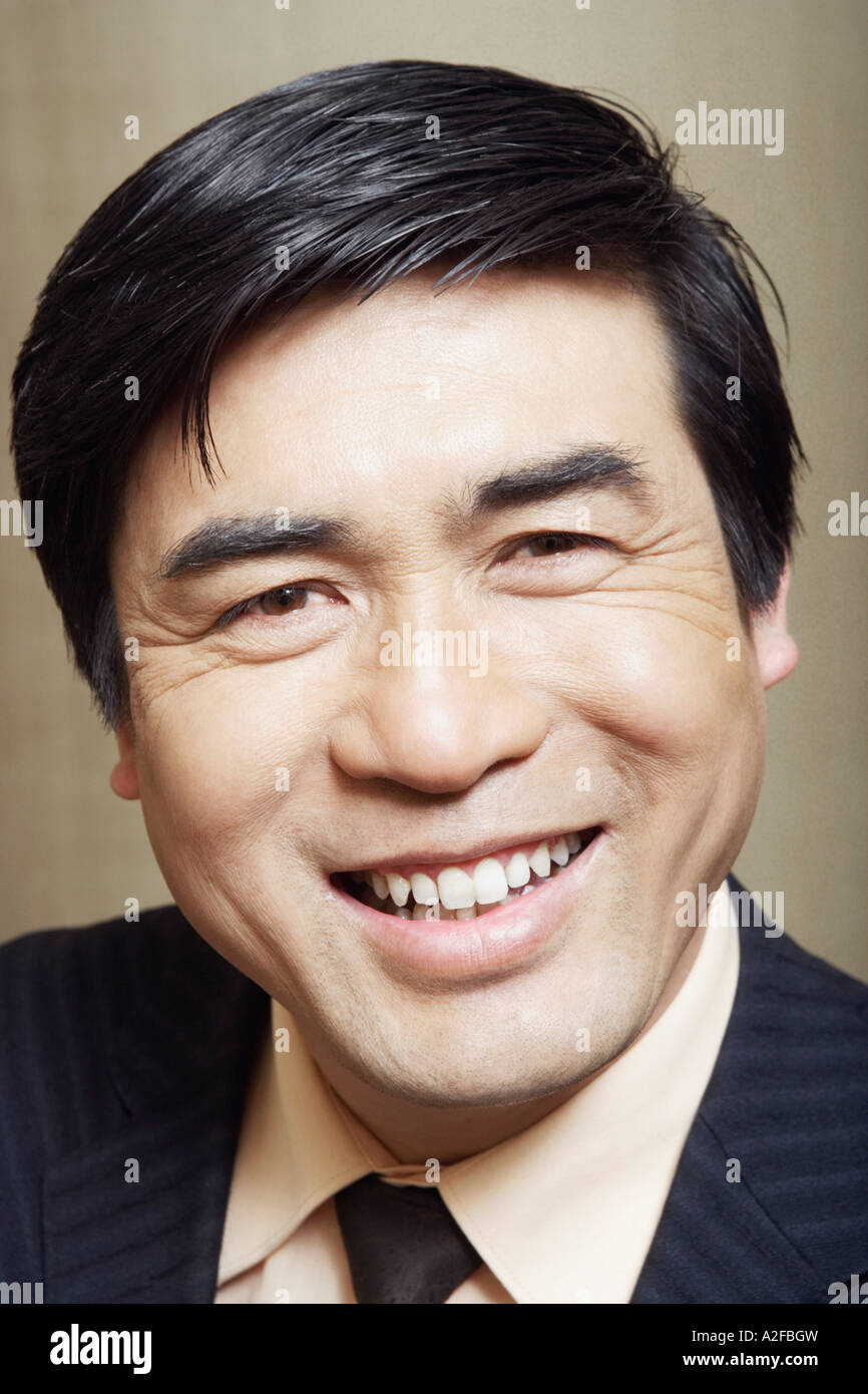 Portrait of a businessman smiling Stock Photo - Alamy