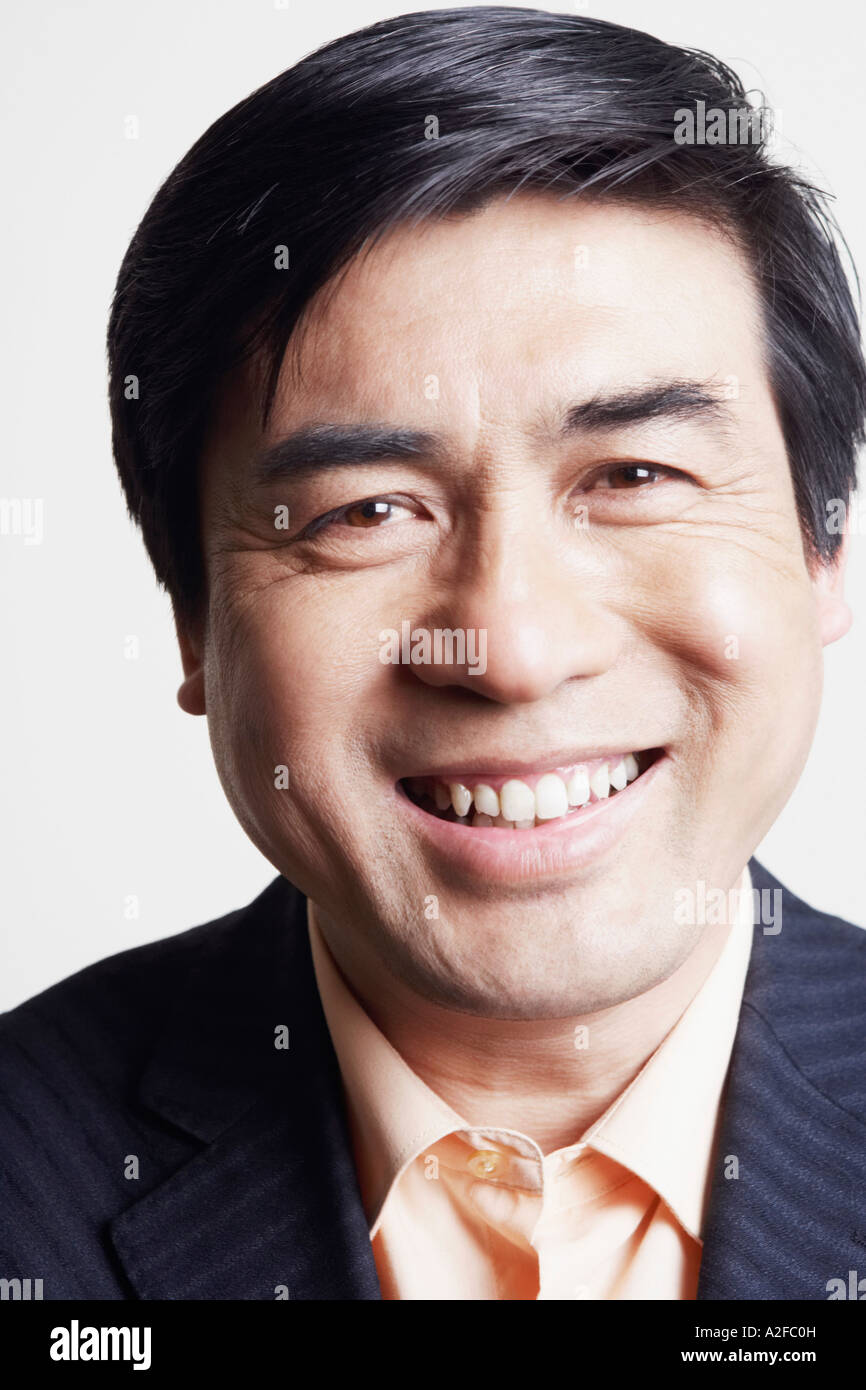 Portrait of a businessman smiling Stock Photo - Alamy