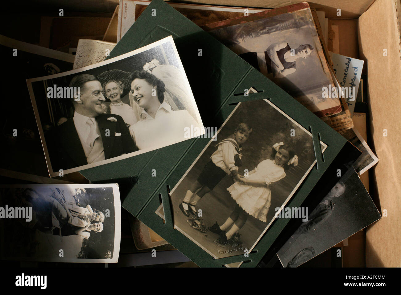 A box of old photographs from yesteryear Stock Photo