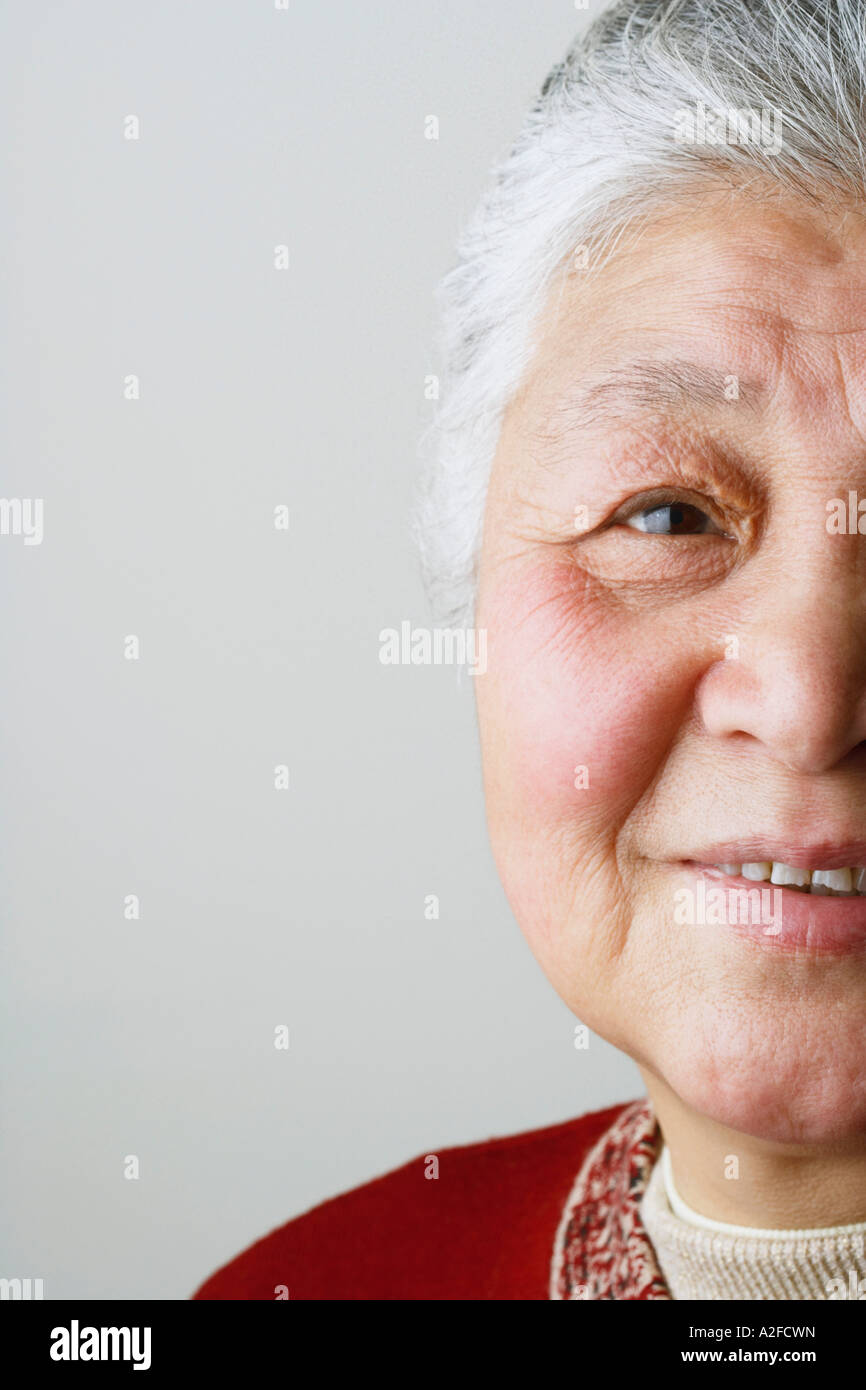 Portrait of a senior woman smiling Stock Photo - Alamy