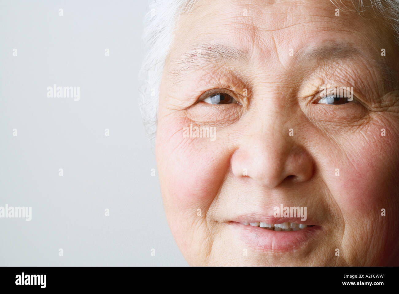 Portrait of a senior woman smiling Stock Photo - Alamy