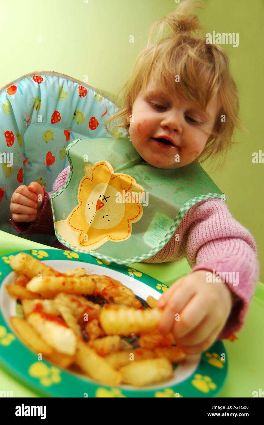 Fat child eating chips hires stock photography and images Alamy