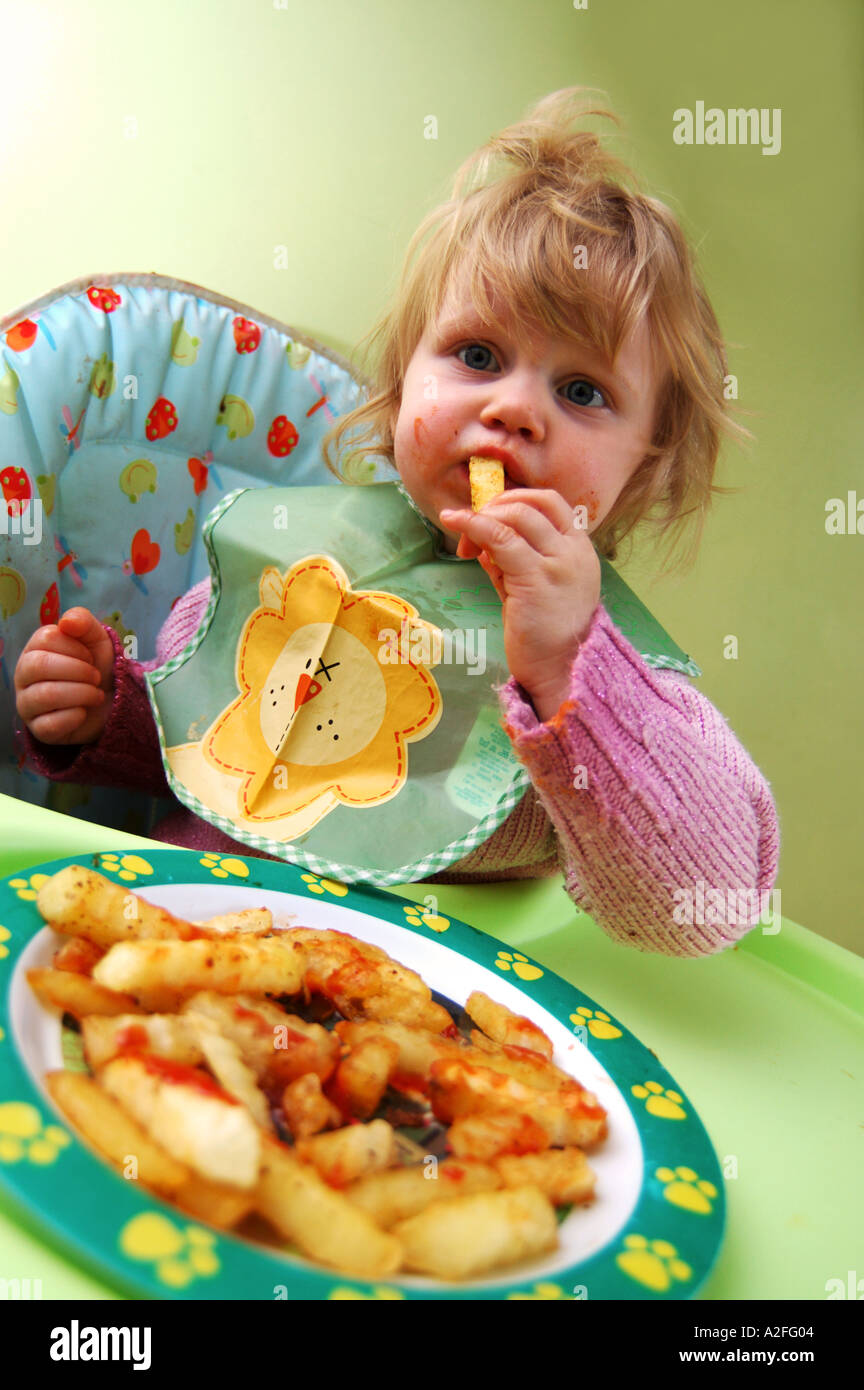 School girl eating chips hires stock photography and images Alamy
