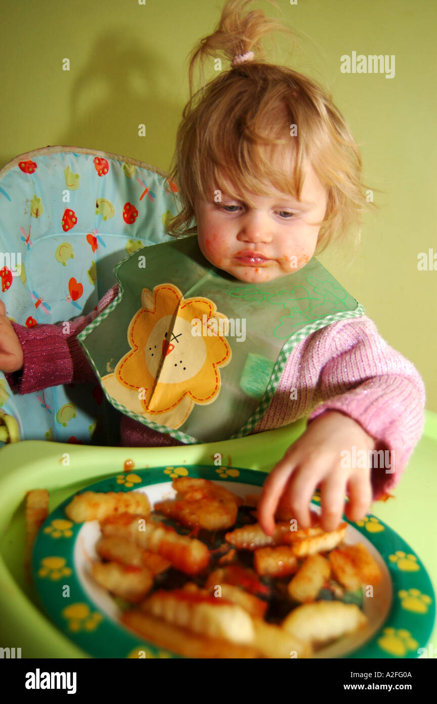 School girl eating chips hi-res stock photography and images - Alamy