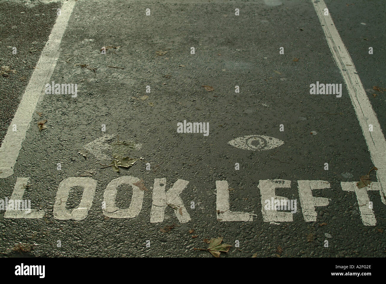 Look Left road safety markings Stock Photo - Alamy