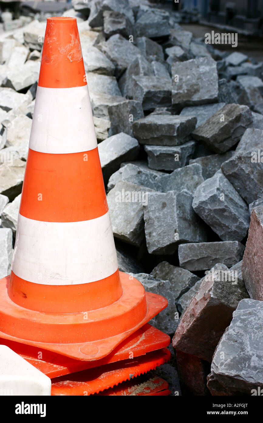 Pylon, traffic cone with cobblestones Stock Photo Alamy
