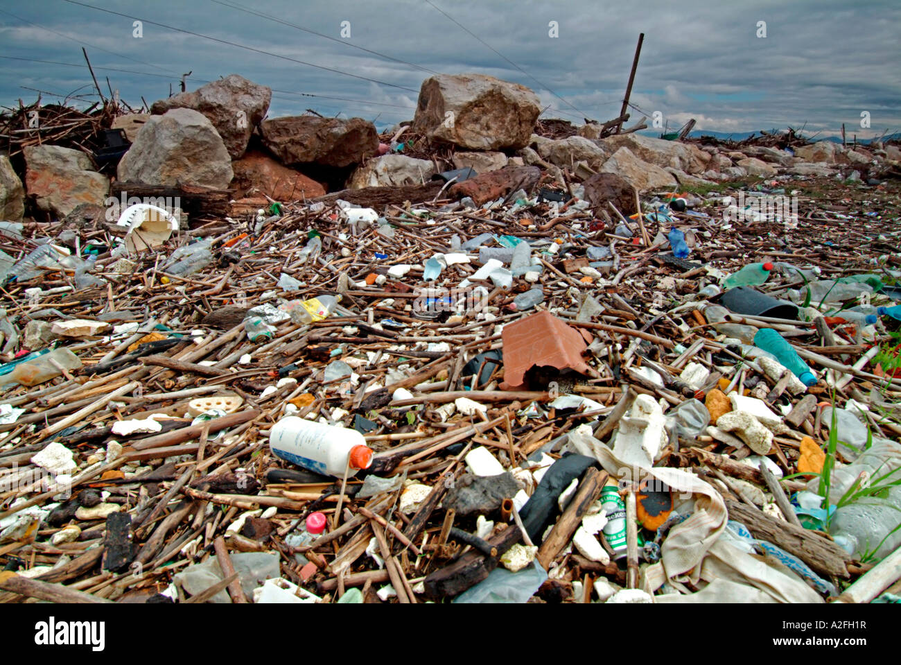 Rubbish on seashore at the beach of Pisa Tuscany Italy Stock Photo