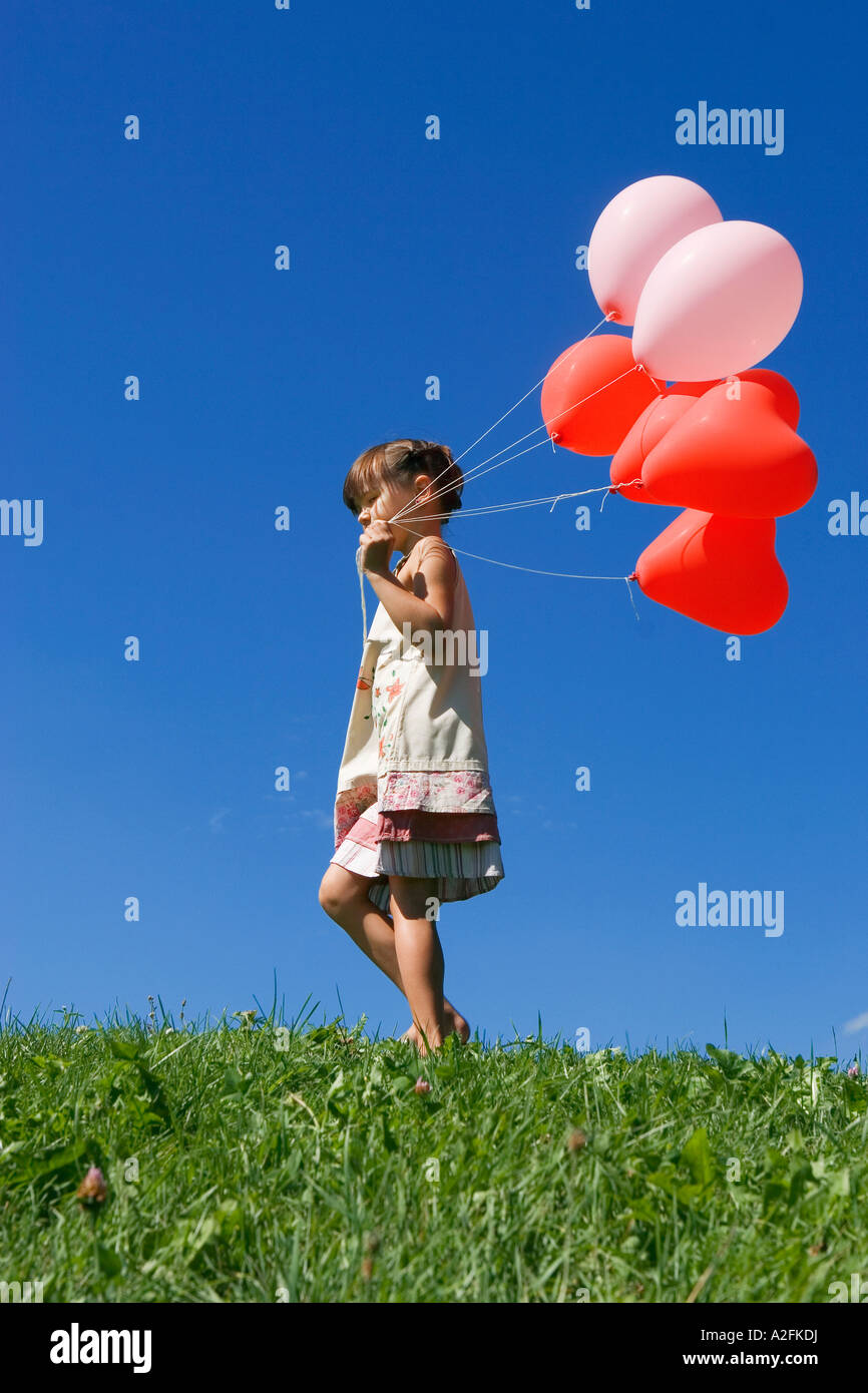 Girl Holding Green Balloon High Resolution Stock Photography and Images ...