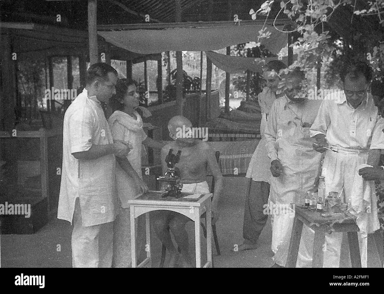 Medical doctor explains to Mahatma Gandhi the hookworm ova Mumbai Bombay Maharashtra India May 1944 Stock Photo