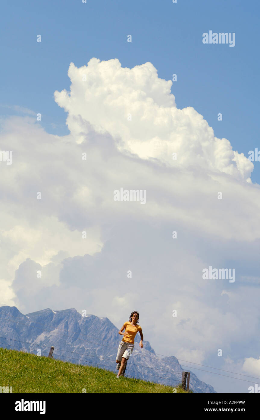 Young woman jogging in mountains Stock Photo - Alamy