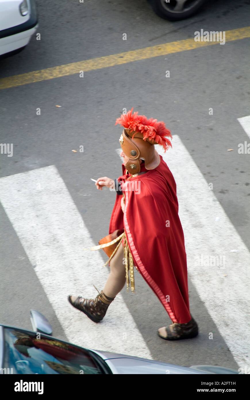 Roman, centurion, in, modern, street, scene, walking, across, the, road, whilst, smoking, a, cigarette, costume, Stock Photo
