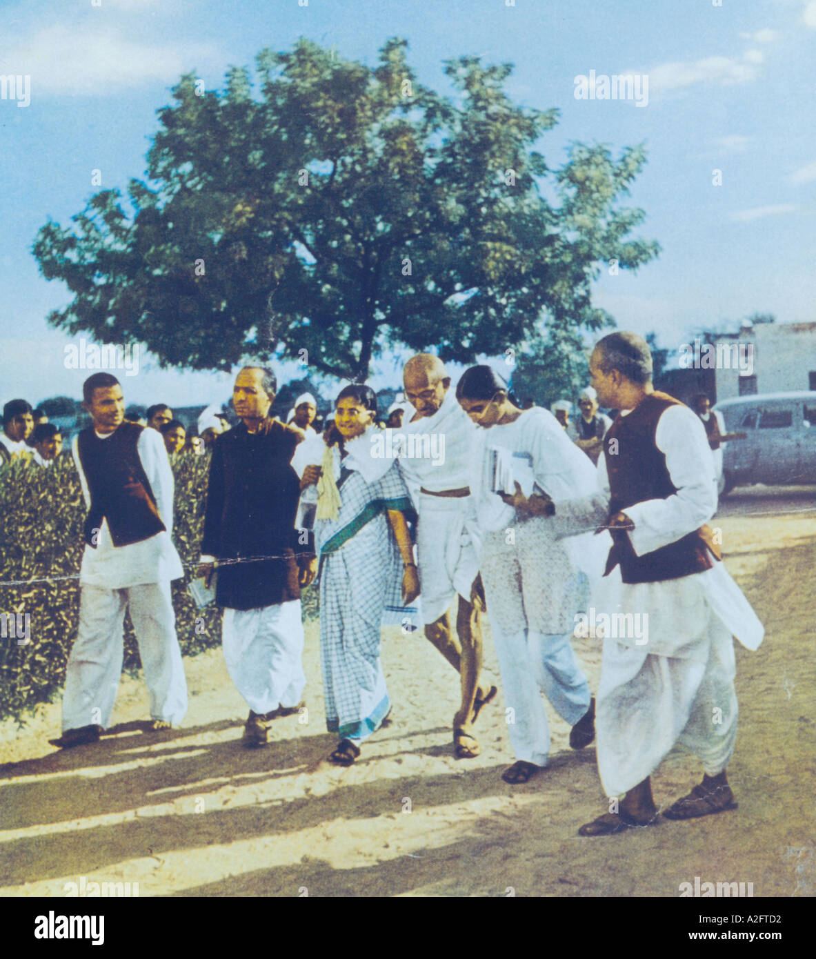 Mahatma Gandhi walking with supporters at Delhi India January 1948 old vintage 1900s picture Stock Photo