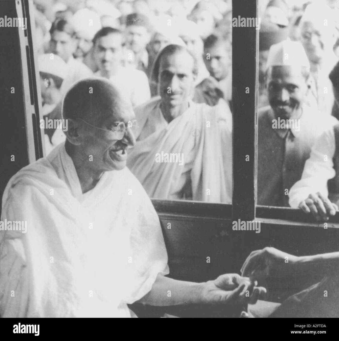 Mahatma Gandhi sitting in a train from Poona to Bombay India 1945 old vintage 1900s picture Stock Photo