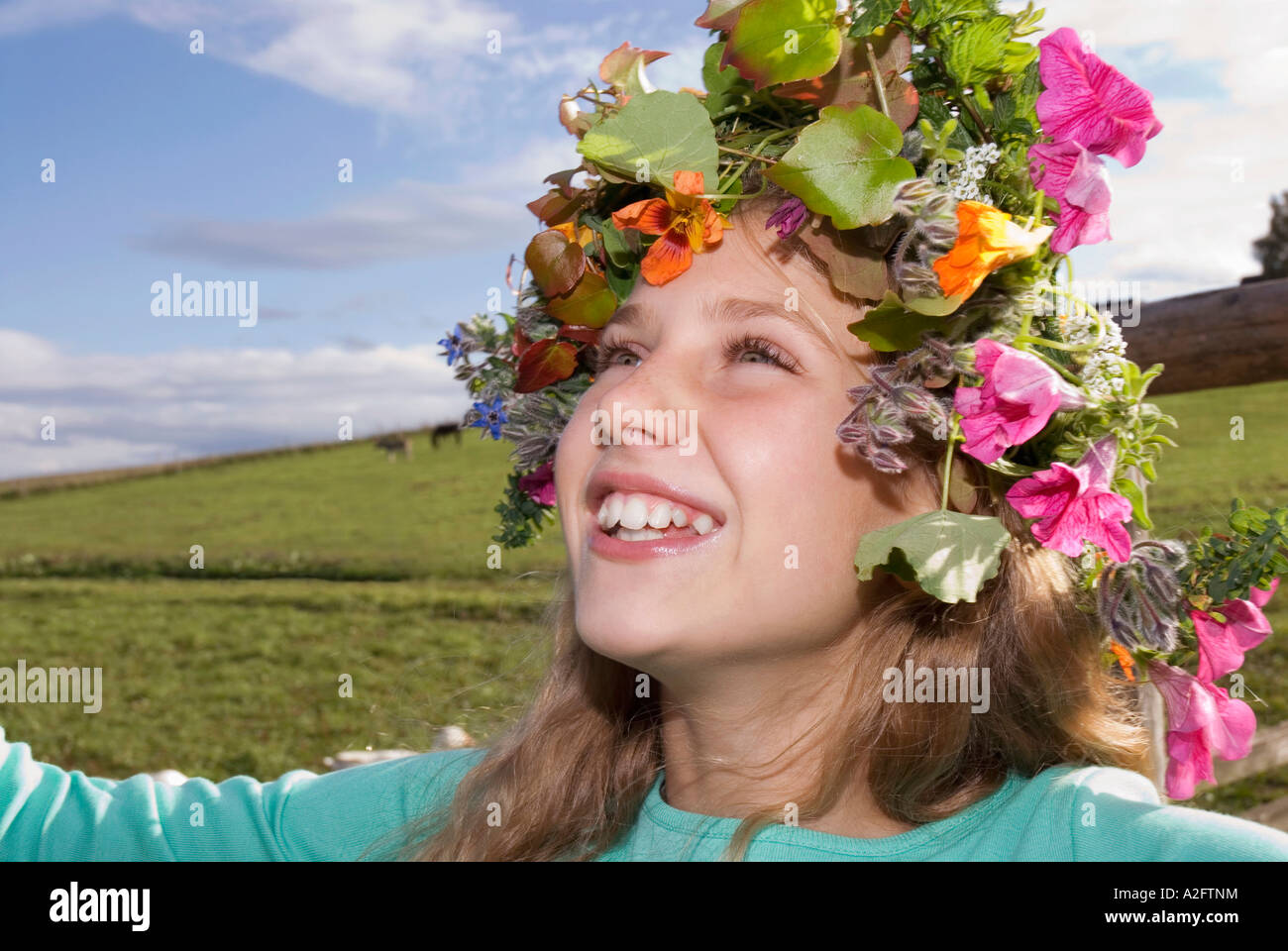 Girl (10-11) wearing wreath of flowers, smiling Stock Photo - Alamy