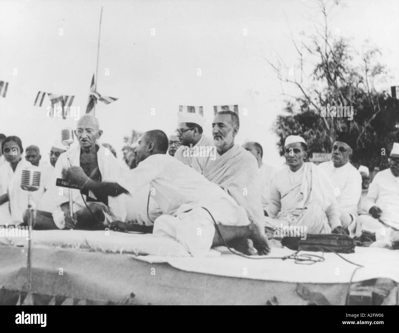 Mahatma Gandhi delivering a speech Also seen his grand nephew Kanu Gandhi front and Khan Abdul Gaffar Khan centre about 1946 Stock Photo