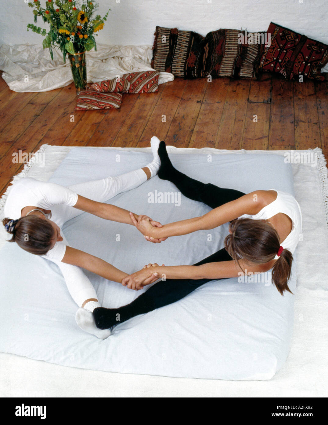Shiatsu and Yoga partner exercise Liver meridian stretch Stock Photo Alamy