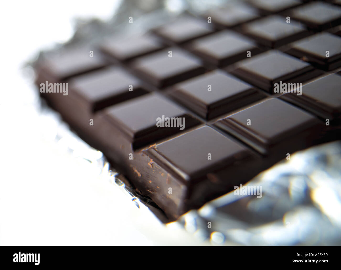 Plain dark chocolate close up on a white background Stock Photo - Alamy