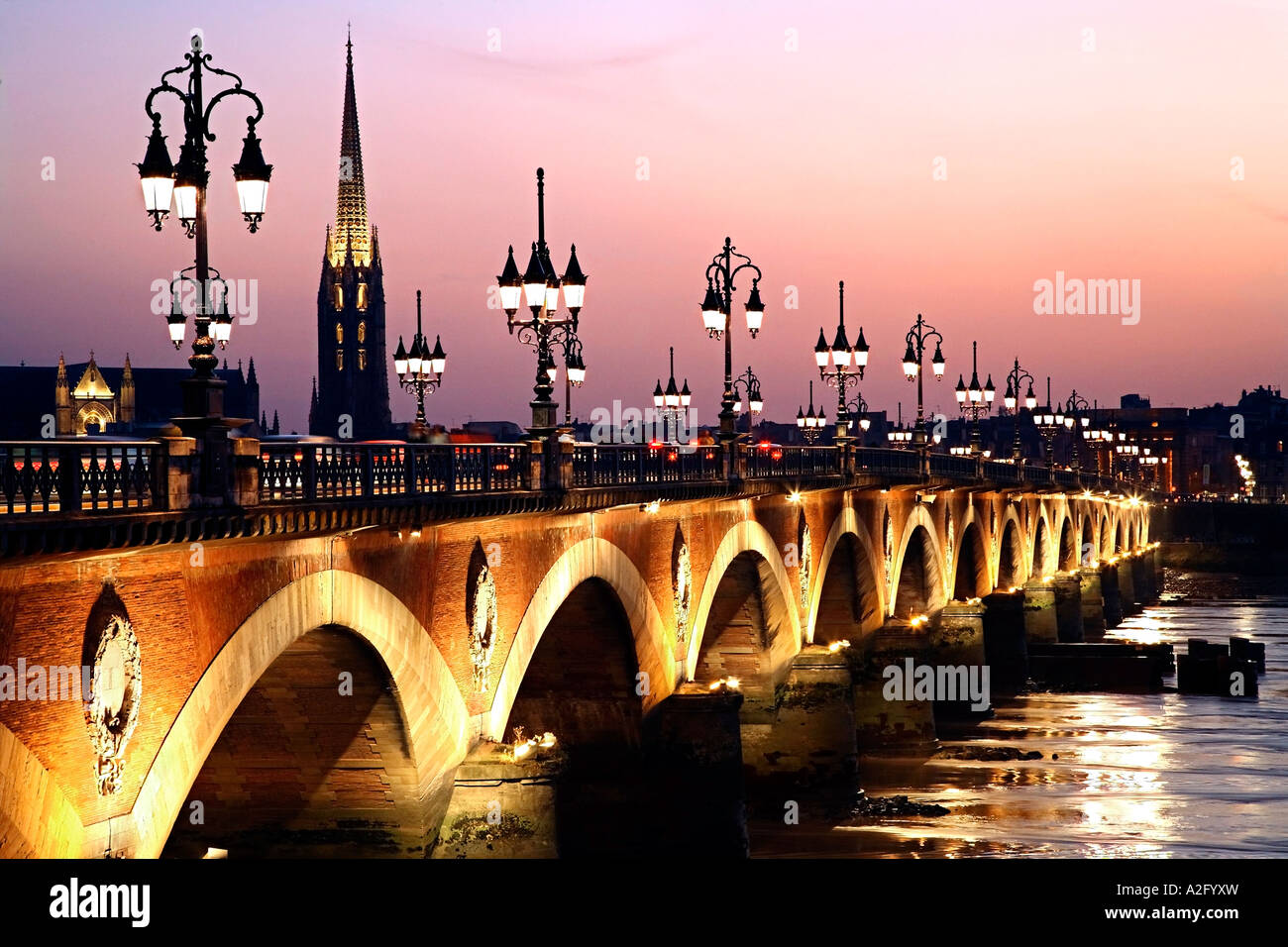 The bridge Pont de Pierre and the river La Garonne at dusk. Bordeaux, France. Stock Photo