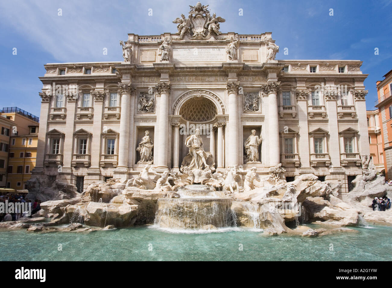 Trevi Fountain in summer sun sunshine and blue sky daylight daytime day Rome Italy Europe EU Stock Photo