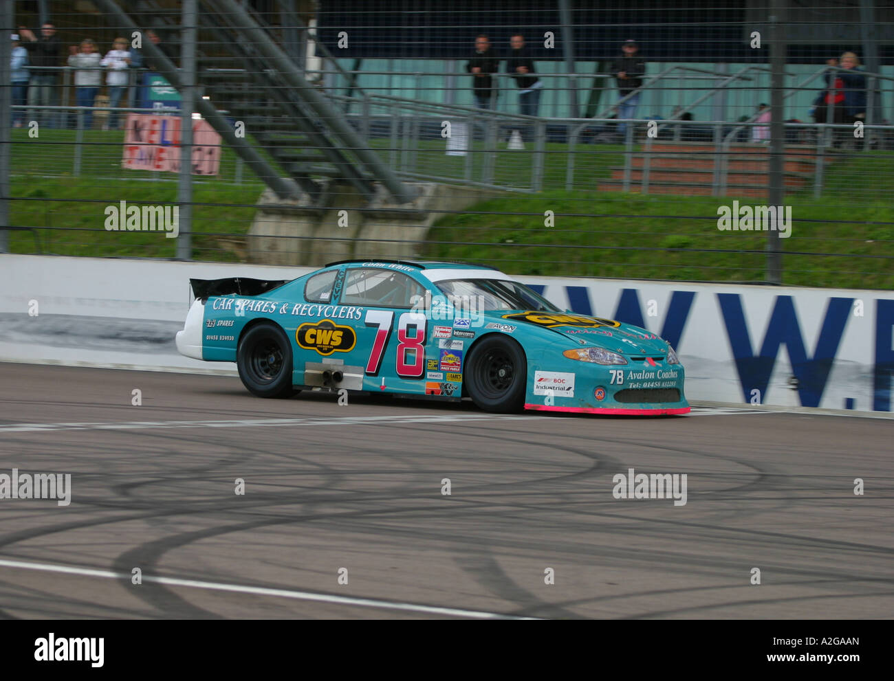 V8 Nascar type stock cars racing on a banked oval circuit Stock Photo ...