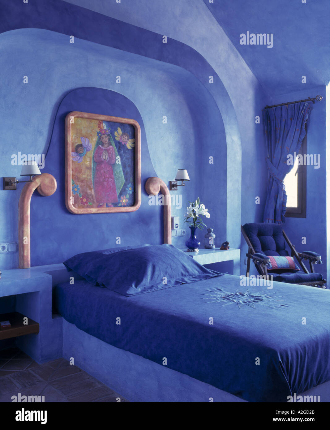 blue painted bedroom in a spanish villa Stock Photo Alamy