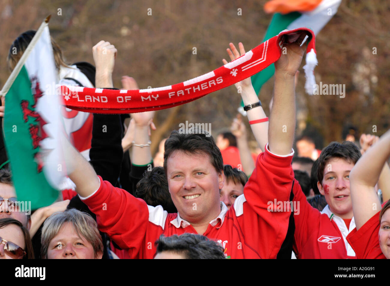 Fans of Ferencvarosi show their support as they hold scarves prior