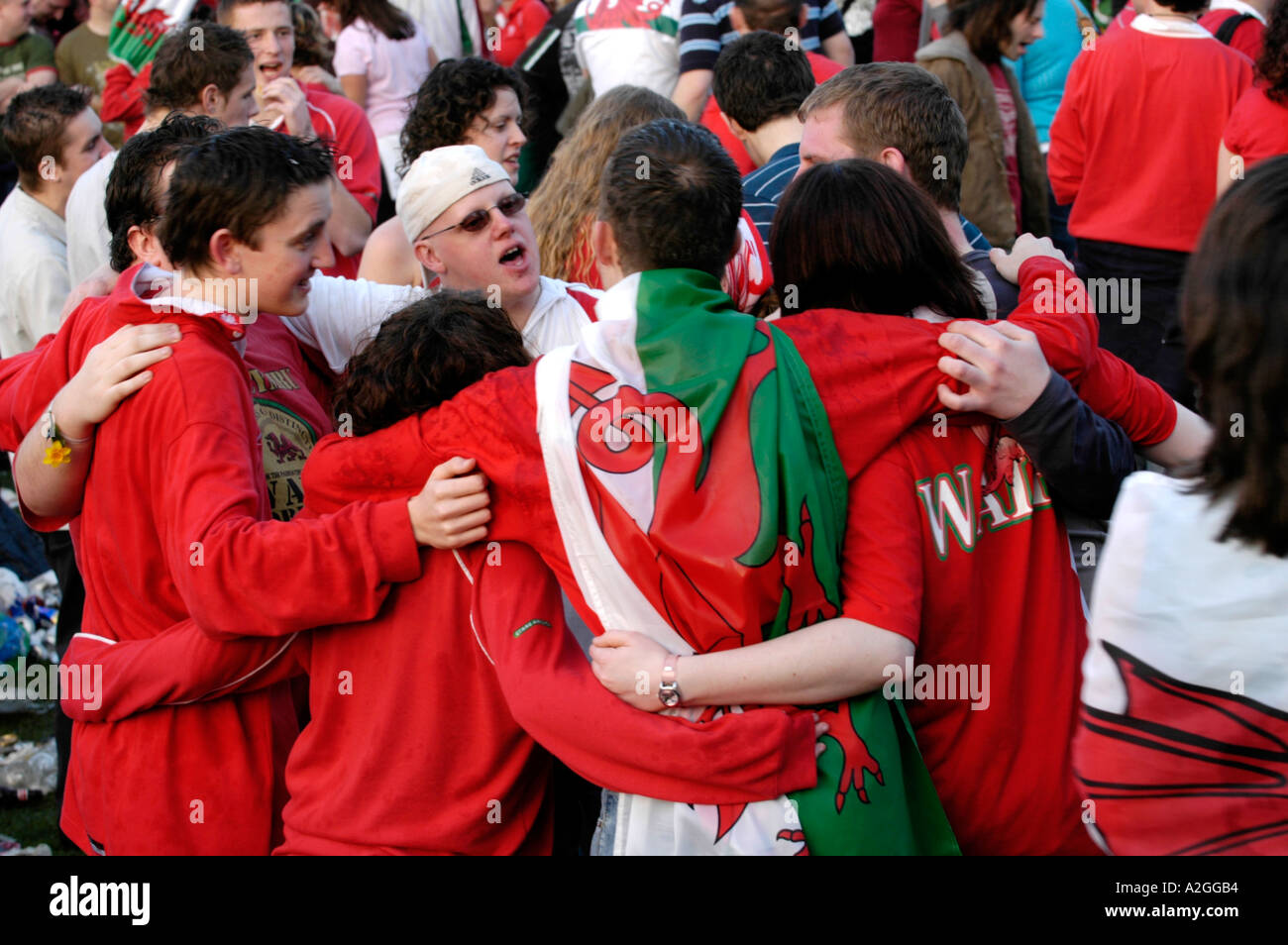 Big crowd of Welsh rugby fans celebrate Wales winning an international
