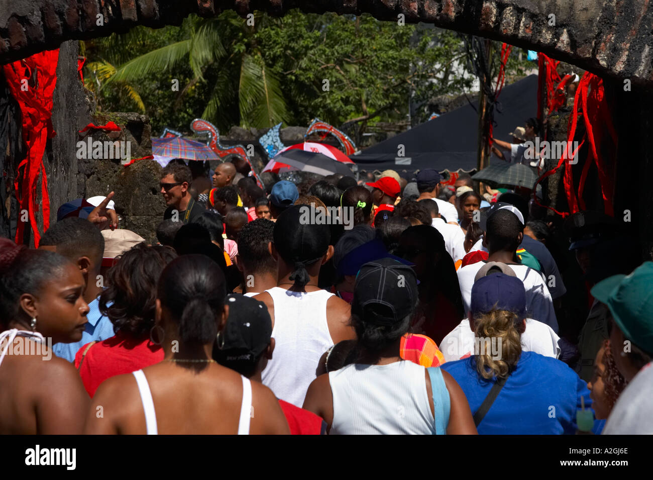 A crowd enters San Geronimo Fort to watch the bi annual meeting of congos and devils. Portobelo, Colon, Panama, Central America Stock Photo