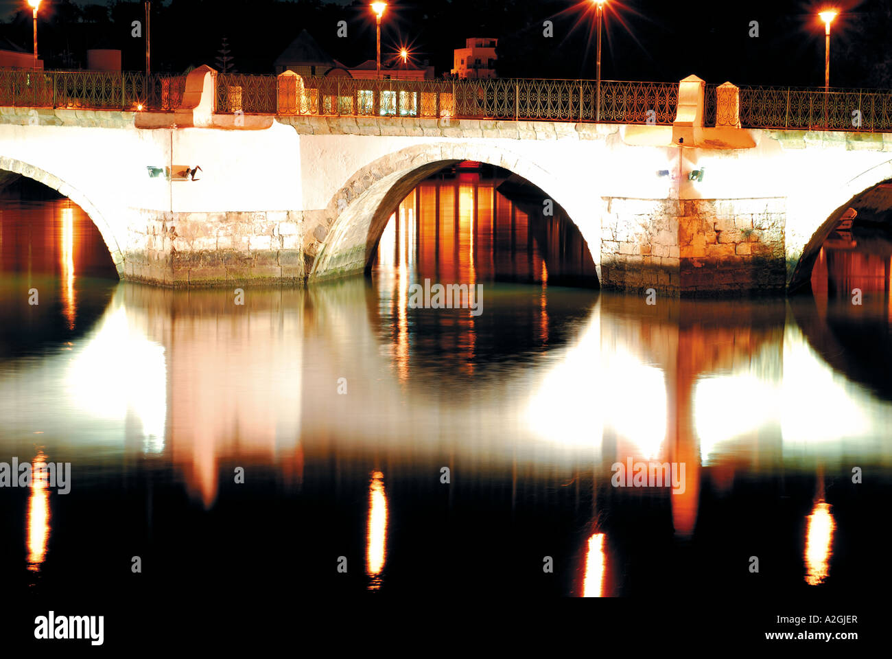 Old Bridge Ponte Velha by night, Tavira, Algarve, Portugal Stock Photo