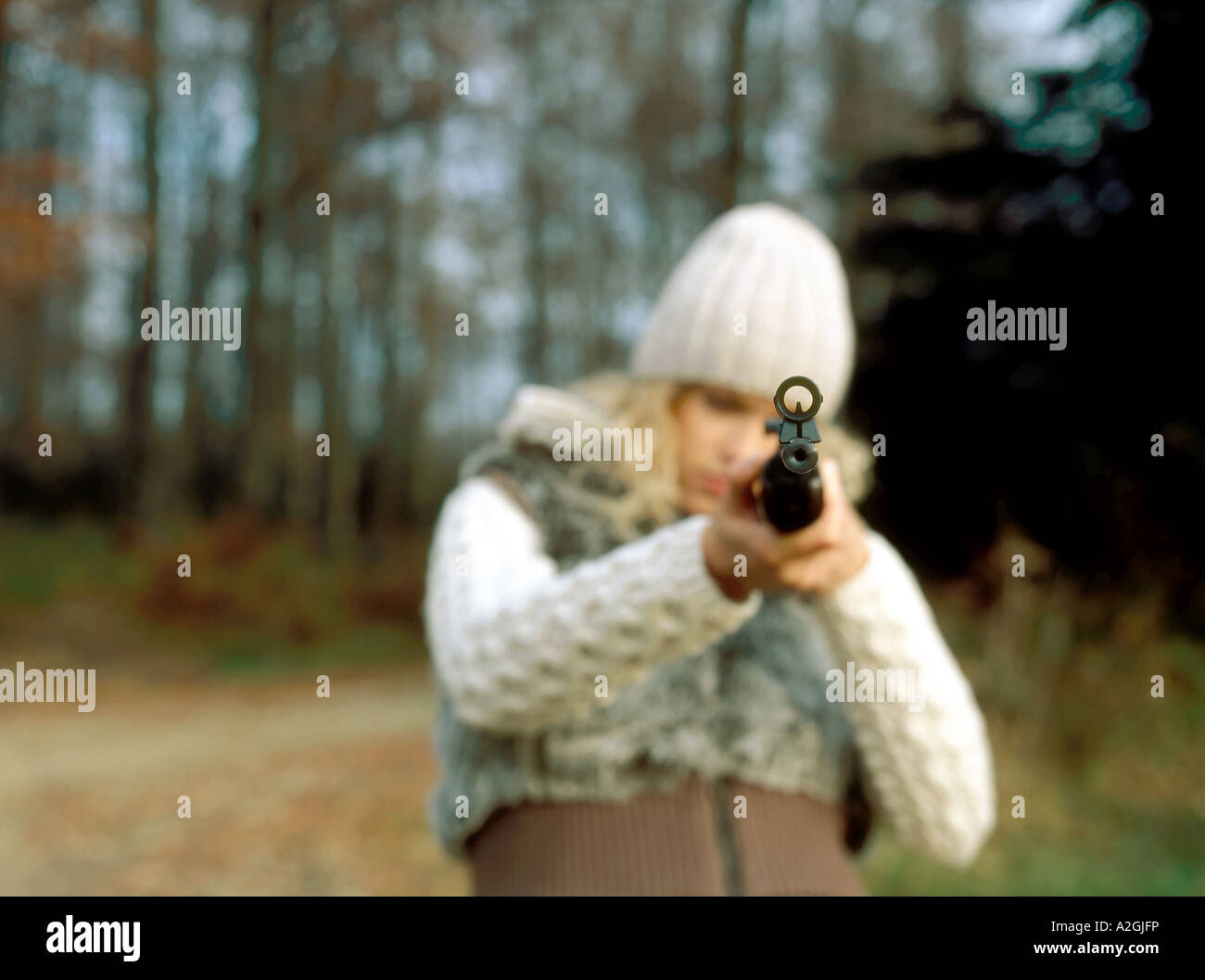 Young woman with hunting rifle hi-res stock photography and images - Alamy