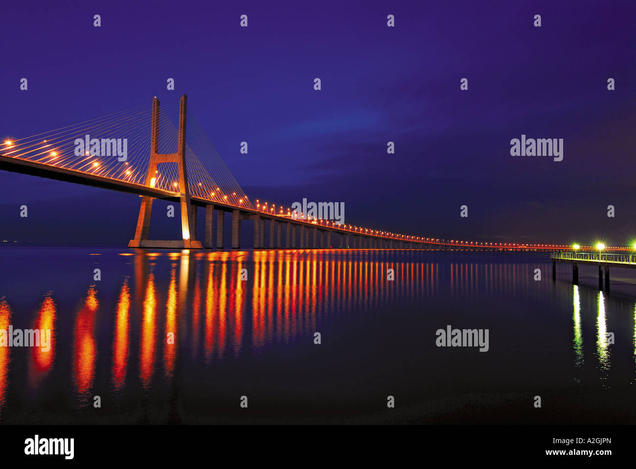 Bridge Ponte Vasco da Gama over river Tejo by night, Lisbon, Portugal Stock Photo