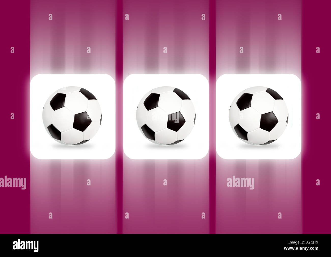 Three balls on a slot machine display 3 Fußbälle auf dem Display eines Spielautomaten Stock Photo