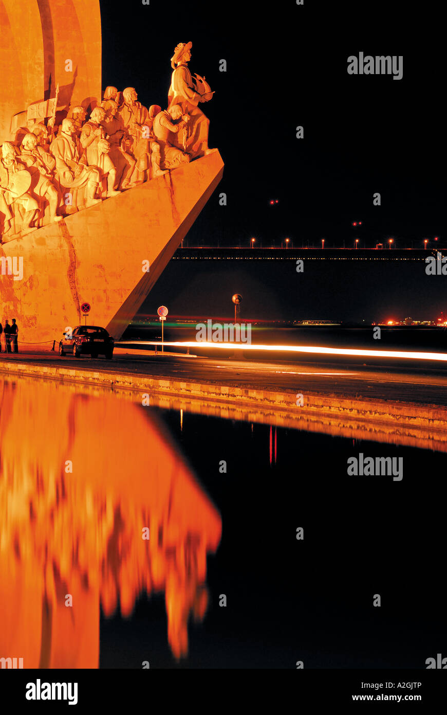 Monument of the Discoveries by night reflecting at the marina, Belem, Lisbon, Portugal Stock Photo