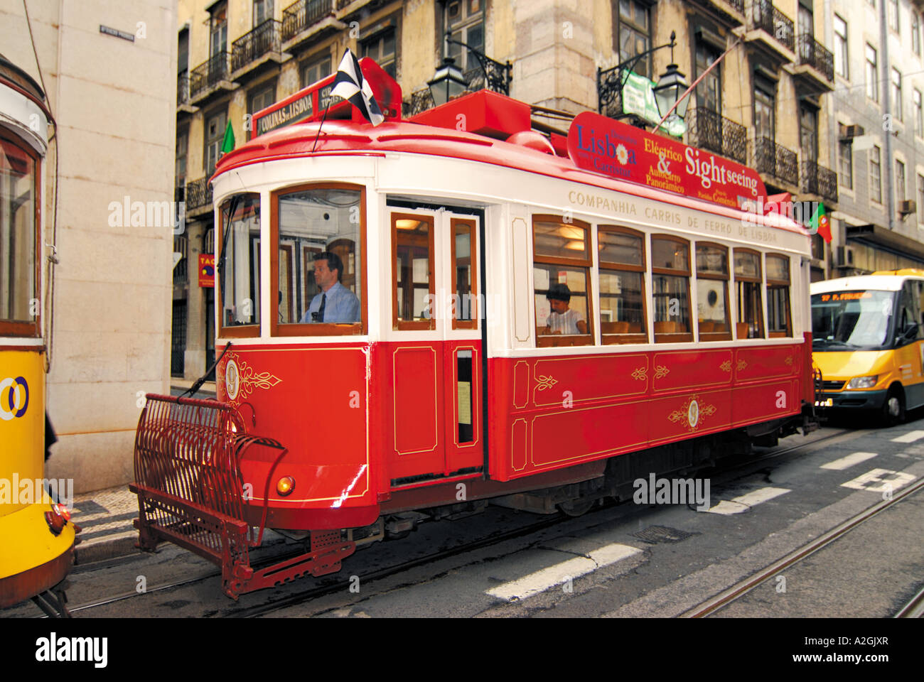 Touristic historic Tram “Electrico” running through the  Colinas de Lisboa, hills of Lisbon, Lisbon, Portugal Stock Photo