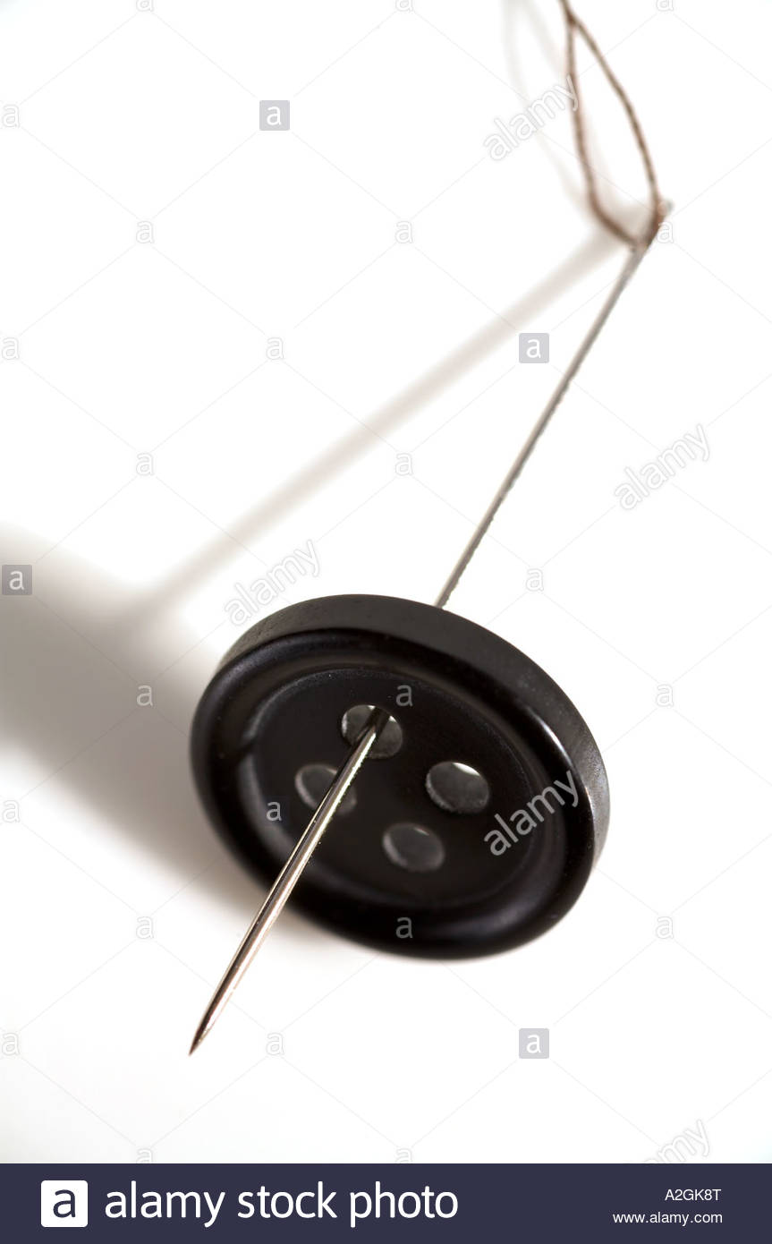 Button, needle and thread Stock Photo Alamy